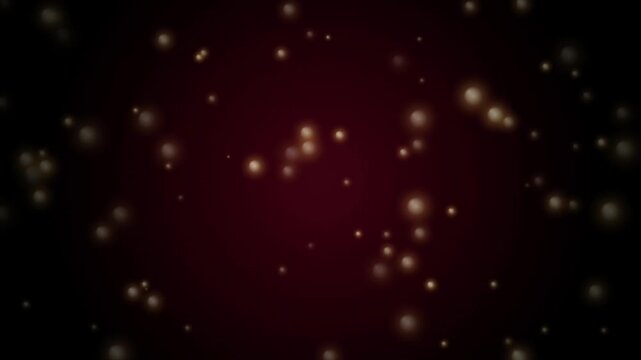 Glowing golden particles floating gently against dark red background, abstract motion graphic.