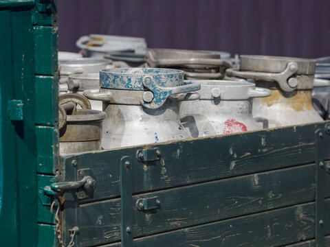 Detail of aluminum container lids on a truck bed.
