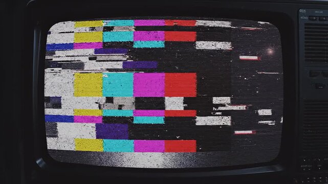 Vintage television screens displaying static and lens flares with cinematic motion during night
