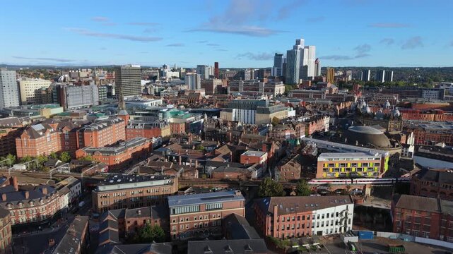 Aerial Video of Train on Railway Viaduct and Leeds Skyline at Sunrise
