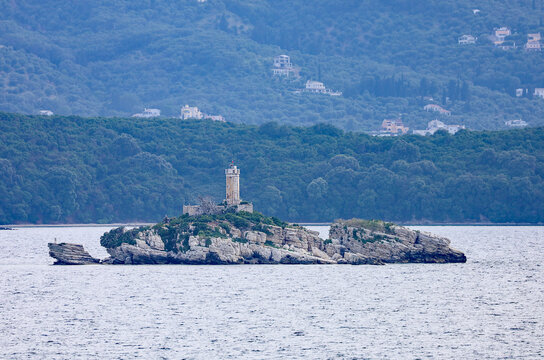 Historic Peristeres Lighthouse on Kaparelli Islet off Corfu, Greece.