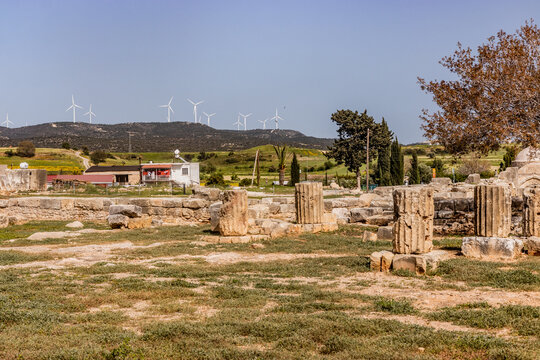 Roman Sanctuary of Aphrodite ruins in Kouklia village with wind power plants in the background, Cyprus