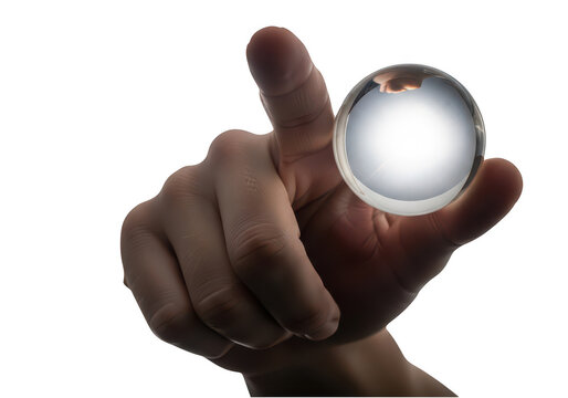 Human hand holding a shiny silver metal sphere isolated on transparent background