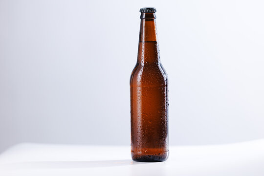 Single brown beer bottle on white background for product background