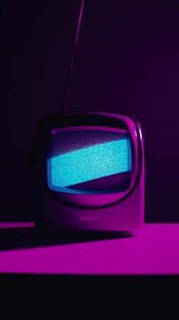 Retro TV, vintage television In a nostalgic setup, a retro TV displays grain on screen, scary halloween night device good for chroma key and green screen.