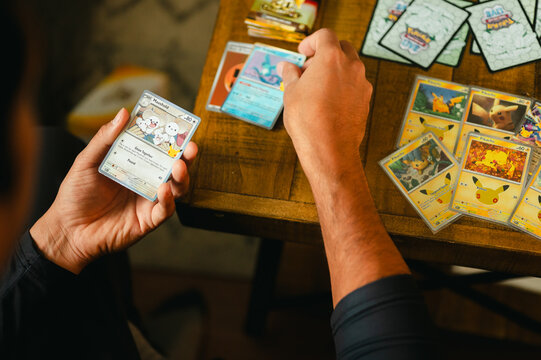 Chicago, IL/USA - September 19, 2026: Opening and sorting Pok&eacute;mon trading cards at home