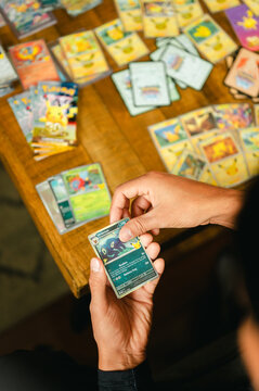 Chicago, IL/USA - September 19, 2026: Person sorting collectible Pok&eacute;mon cards from the 30th Celebration set
