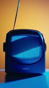 Retro TV, vintage television In a nostalgic setup, a retro TV displays grain on screen, scary halloween night device good for chroma key and green screen.