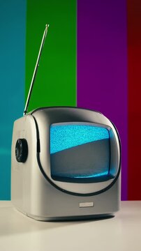 Retro TV, vintage television In a nostalgic setup, a retro TV displays grain on screen, scary halloween night device good for chroma key and green screen.