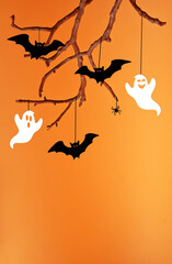 Fototapeta na wymiar Halloween background with black bats sitting on tree.