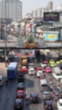 Bokeh view of road traffic in Bangkok, Thailand. Blurred background vertical footage.