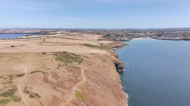 Seven Souls Rock and Pentire Point and Bay over Padstow Bay from a drone, Polzeath, Cornwall, England, Summer 2026