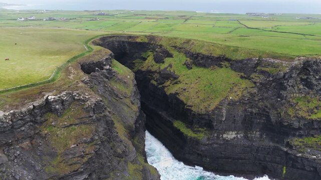 Aerial view of a narrow sea inlet at Hag's Head, Cliffs of Moher, County Clare, Ireland