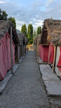 Row of Thatched Budget Trekker Shelters at Manthali Accommodation Camp Nepal
