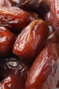 Pile of tasty dried dates as background, closeup