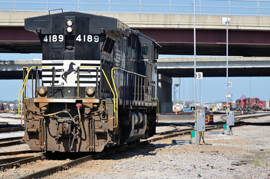 A Norfolk Southern Railway locomotive awaits assingment and departure from a Canadian Pacific Kansas City railroad yard. 