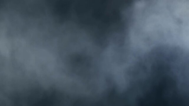 Wisps of atmospheric mist drifting slowly across a dark moody background creating a sense of mystery and depth