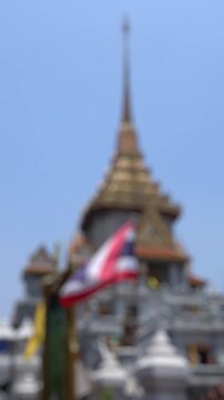 Bokeh view of beautiful architecture of Wat Traimit, Golden Buddha temple in Bangkok, Thailand. Blurred background vertical footage.