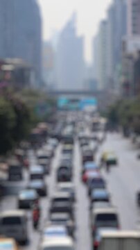 Bokeh view of road traffic in Bangkok, Thailand. Blurred background vertical footage.