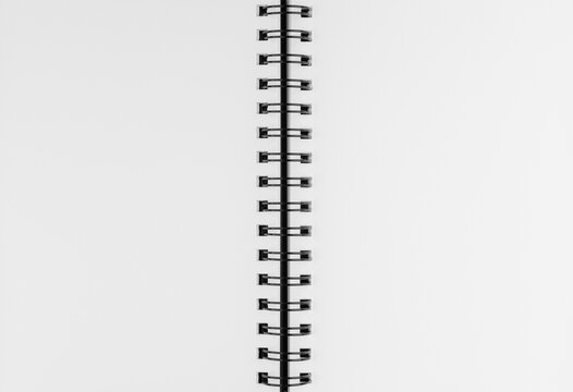 Close up of open spiral notebook blank white paper page with copy space