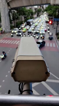 CCTV security camera observing city traffic on intersection roads, Urban Security, City Monitoring System, Crime Detection, Privacy Repression, Video Recording, Camera POV