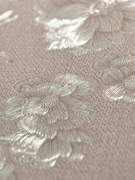 Delicate floral texture with shimmering silver details on soft fabric