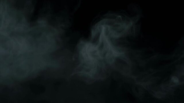 Wispy smoke plumes drifting across a dark background with cinematic motion