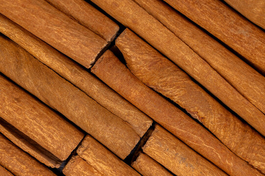 Cinnamon sticks creating an aromatic bark spice background