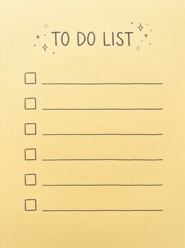 Handwritten to do list on textured beige paper with blank check boxes