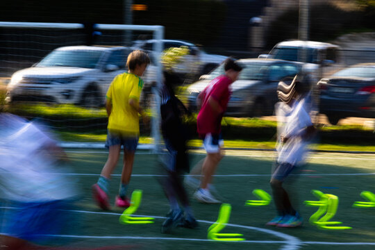blur of color and motion, soccer game at sunset