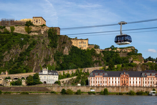 Koblenz Cable Car crossing the river with historic fortress and buildings along the riverbank in Germany