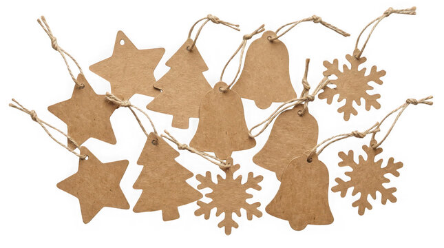 Collection of rustic cardboard gift tags in shapes of stars, trees, bells, and snowflakes isolated on transparent background