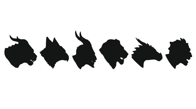 Sculpted black monster and animal heads arranged in a row showcasing detailed textures against a plain white studio background