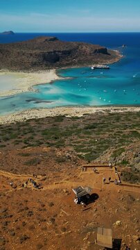 Vertical video aerial descent toward Balos Lagoon