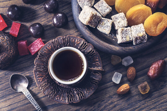 Turkish coffee served with assorted nuts dried fruits and Turkish delight
