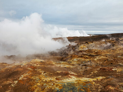 Cloudy and rainy day. Steam vents of Gunnuhver Hot Springs. Mysterious, active geothermal area with volcanic craters and mud pools. M&ouml;&eth;ruvellir, M&ouml;&eth;ruvallavegur, Reykjanes Peninsula, Iceland.