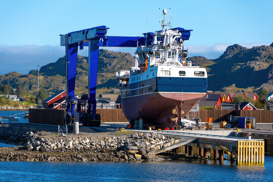 Fishing vessels and shipyard in Ballstad harbor on the Lofoten Islands, Norway
