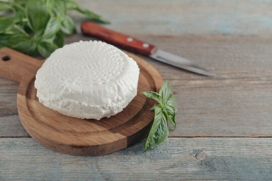 Bryndza cheese on a wooden cutting board