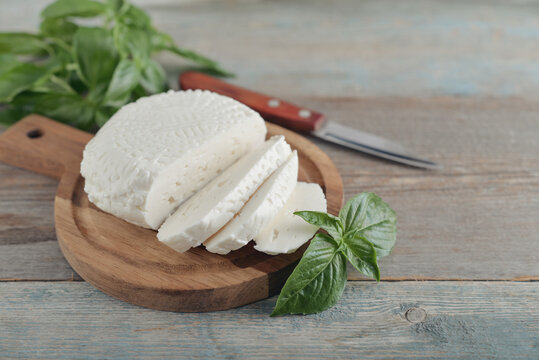 Bryndza cheese on a wooden cutting board
