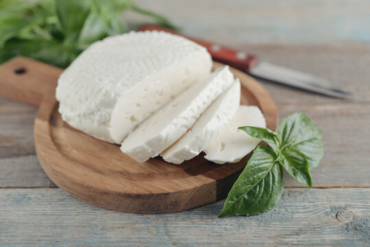 Bryndza cheese on a wooden cutting board