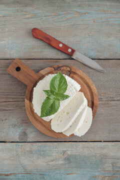 Bryndza cheese on a wooden cutting board
