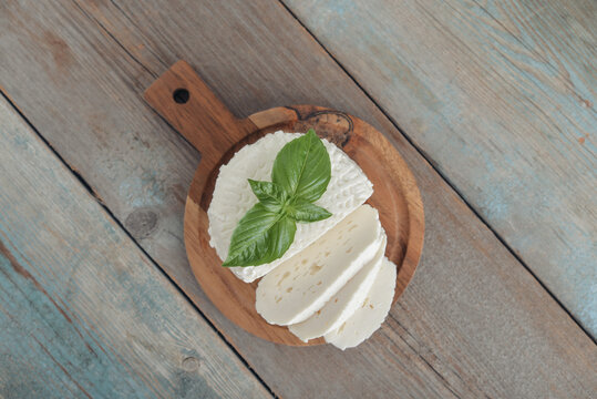 Bryndza cheese on a wooden cutting board