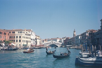 Grand Canal and Rialto Bridge with Gondolas in Venice, Italy © Daniels