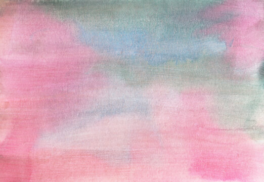 A beautifully hand-painted watercolor background faded pink, blue and green colors