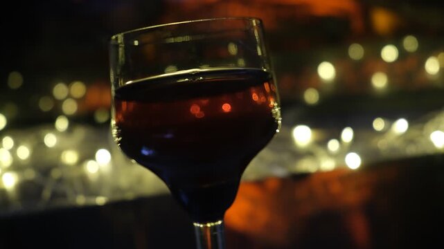 Glass of fine brandy. Rich, warm tones of the spirit mirror the fire&rsquo;s glow, creating a scene steeped in coziness and calm. Perfect winter evening&nbsp;&mdash;&nbsp;slow, indulgent, and utterly peaceful.
