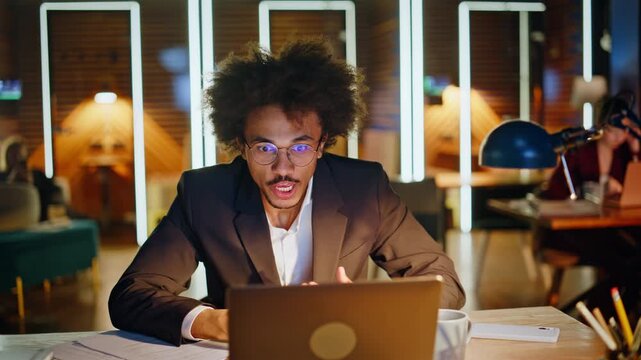 Surprised business man reading good news laptop office. Amazed manager papers.