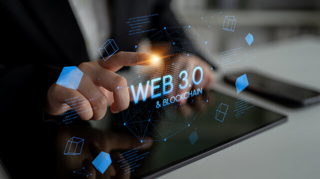 Digital Interface of Web 3.0 and Blockchain Technology with Futuristic Graphics and Touch Interaction by Business Professional. Entropy.