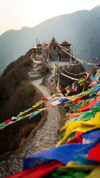 Tibetan Monastery with Prayer Flags on Mountain Slope