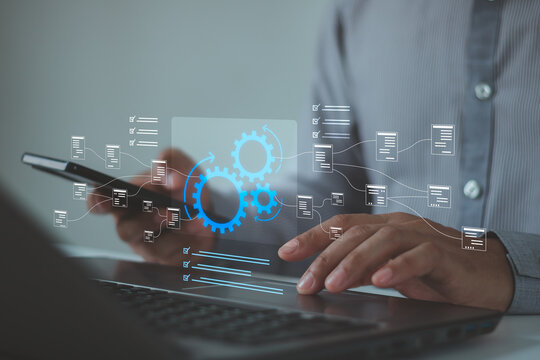Business process automation concept with digital checklist and gear icons over laptop and smartphone. Workflow management, productivity improvement, task tracking, operational efficiency technology.