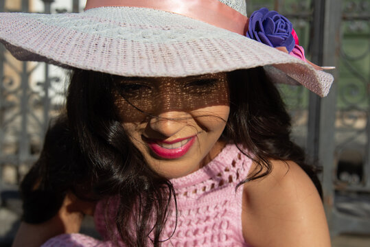 Close-up of a Smiling Woman Wearing a Hat